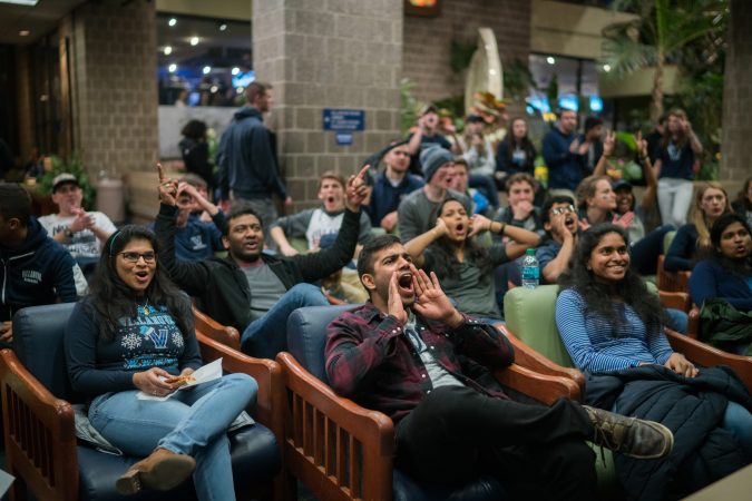 Villanova students gather at the Connelly Center to watch the 
men's basketball team play in the NCAA Championship against Michigan. (Branden Eastwood for WHYY)