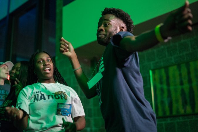 Villanov student Nkiambi Sokolo dances at half time during the NCAA men's basketball championship. (Branden Eastwood for WHYY)