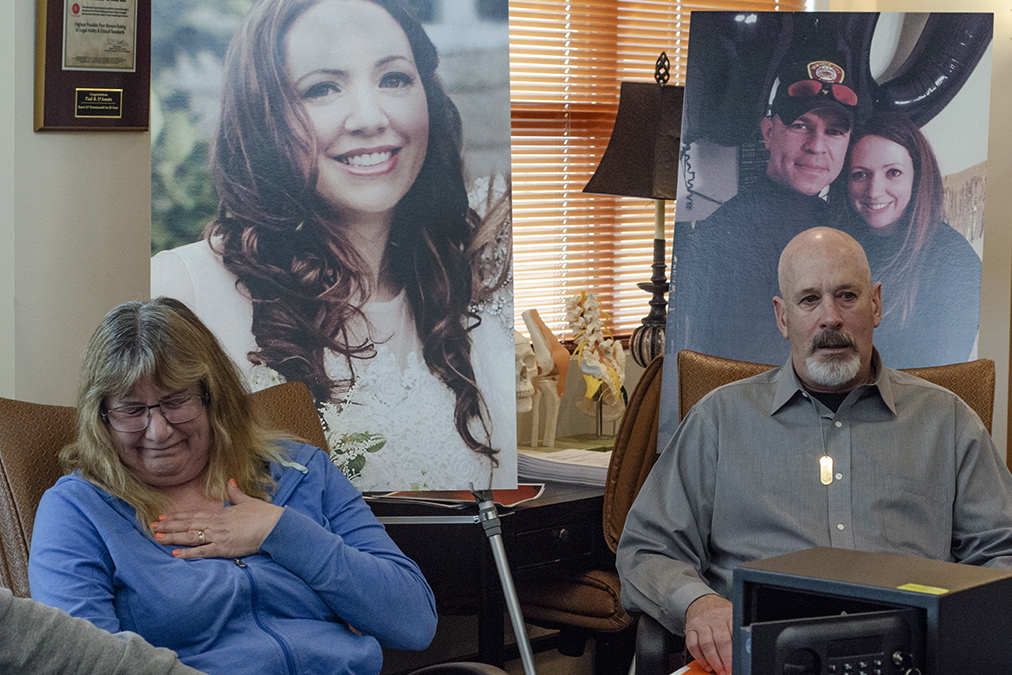 Gun Presser22174 Carol McDowell gets emotional as she and Kevin McDowell sit in front of photos of their daughter Kelly Ann McDowell during a press conference. McDowell killed herself with the service revolver of her boyfriend, Ventnor Police Sgt. Frank O'Neill.