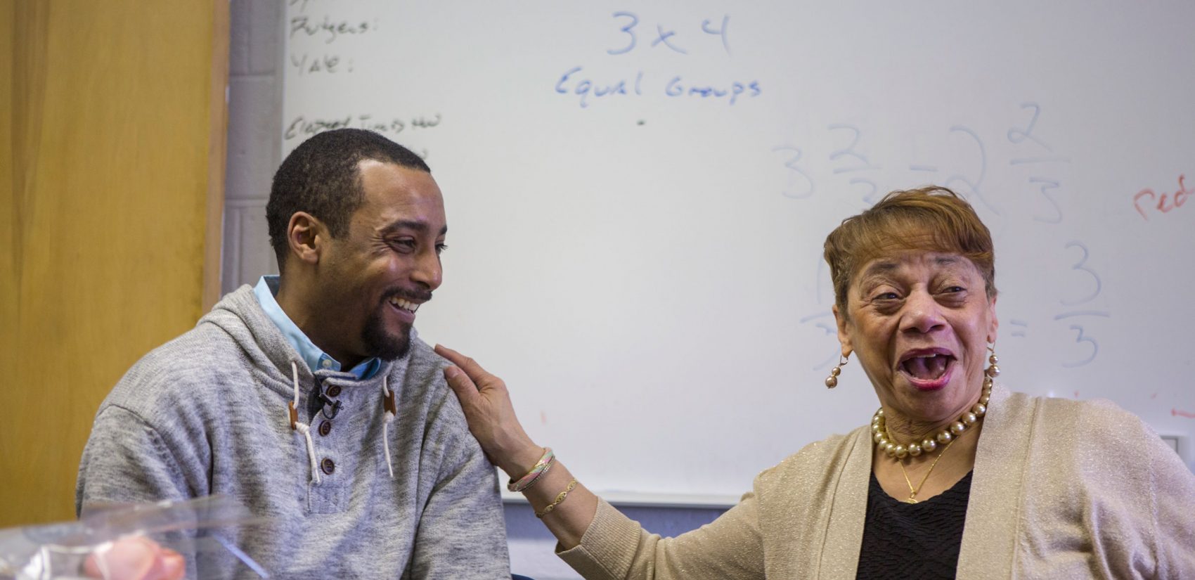 Jovan Weaver and Marie Brown, who was his tenth-grade geometry teacher at Abraham Lincoln High School. (Jessica Kourkounis/WHYY)