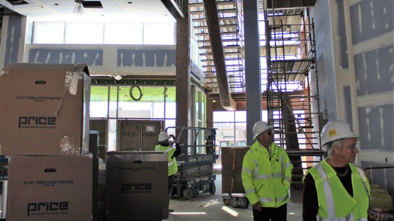 The main entrance to the new academic building features a large open space and an open staircase. (Bill Barlow/for WHYY)