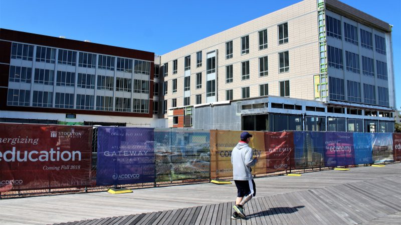 The view of Stockton’s new beachfront student housing from the Atlantic City boardwalk. Construction is underway, with the first students expected to  move in at the end of August. (Bill Barlow/for WHYY)