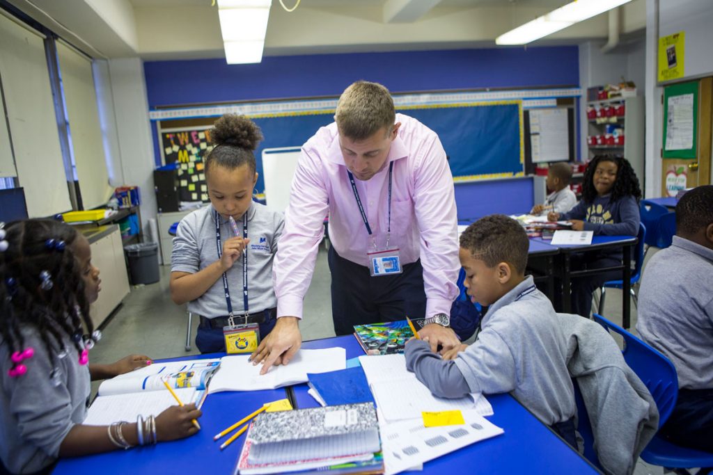 IMG_8556_SFW Nate Higgins works with students on math problems. (Jessica Kourkounis/WHYY)