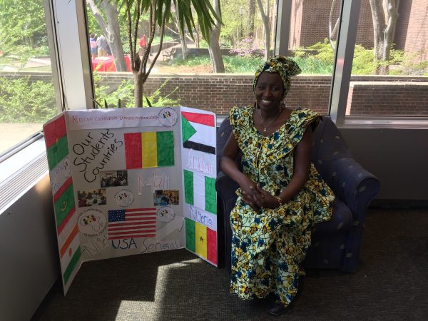 Aminata Sy sits at Penn's Van Pelt Library.
(Photo courtesy of Aminata Sy)