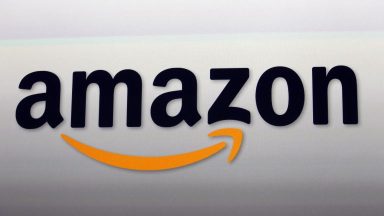 The Amazon logo in Santa Monica, Calif. Amazon Web Services has government contracts that show its influence is far beyond the Post Office. (Reed Saxon/AP)