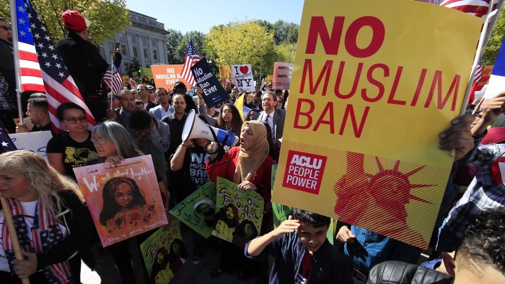 Demonstrators at a rally in Washington, D.C., protest the Trump administration’s proposed travel ban, which goes before the Supreme Court Wednesday. Demonstrators at a rally in Washington, D.C., protest the Trump administration's proposed travel ban, which goes before the Supreme Court Wednesday.