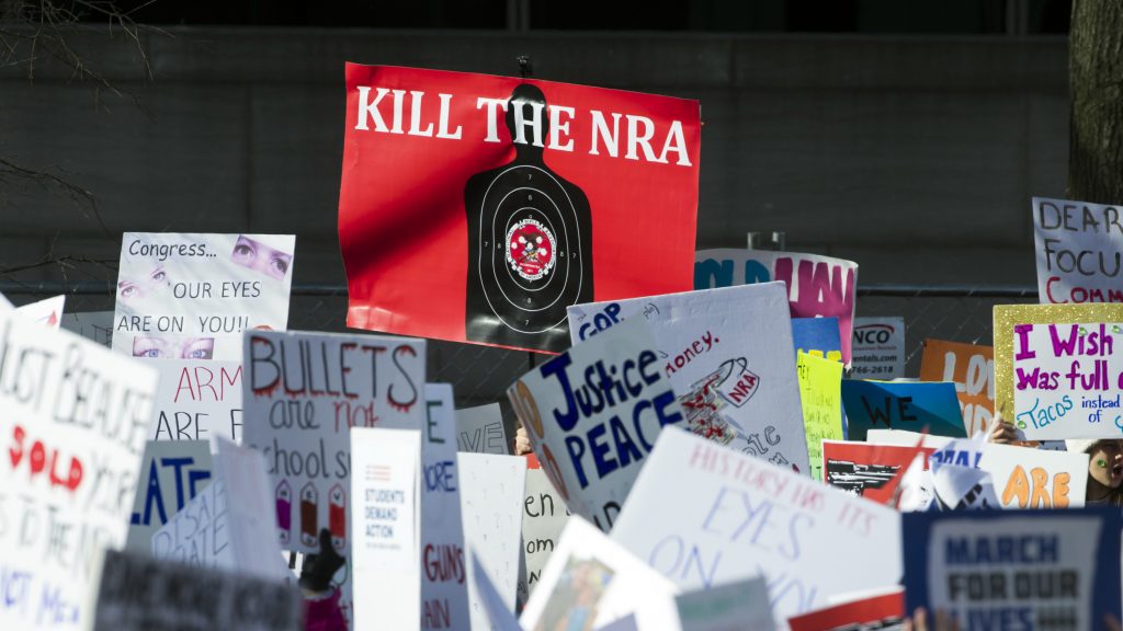 Protesters hold signs aloft as they attend the March for Our Lives rally in support of gun control in Washington, D.C., last month. Protesters hold signs aloft as they attend the March for Our Lives rally in support of gun control in Washington, D.C., last month. (Cliff Owen/AP)