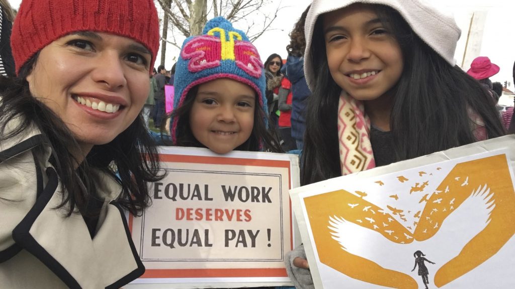 A federal court has sided with Aileen Rizo, who filed suit after realizing her male counterparts were being paid more. The ruling overrules a previous interpretation of the 1963 Equal Pay Act. Rizo is seen here with her daughters in a photo she provided to the AP in 2017. A federal court has sided with Aileen Rizo, who filed suit after realizing her male counterparts were being paid more. The ruling overrules a previous interpretation of the 1963 Equal Pay Act. Rizo is seen here with her daughters in a photo she provided to the AP in 2017. (Aileen Rizo/AP)