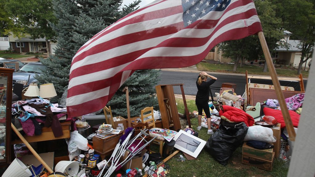 Julie Holzhauer stands among her family’s possessions after being evicted from her home in Centennial, Colo., in 2011. Julie Holzhauer stands among her family's possessions after being evicted from her home in Centennial, Colo., in 2011. (John Moore/Getty Images)