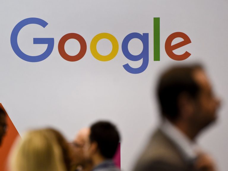 People pass by the Google logo at the Web Summit in Lisbon on Nov. 8. Europe's new data privacy rules go into effect May 25. (Patricia De Melo Moreira/AFP/Getty Images) 