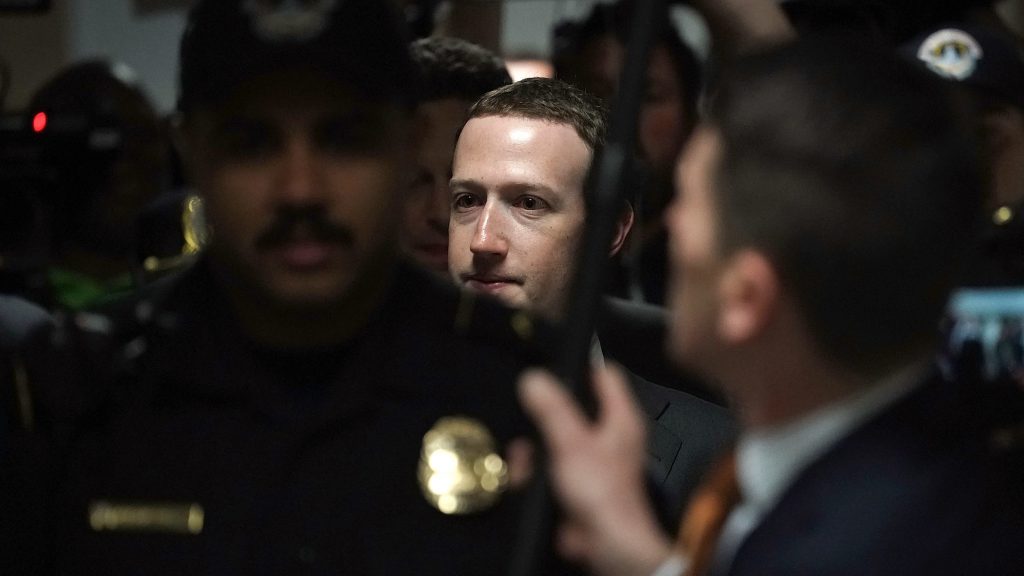 Facebook CEO Mark Zuckerberg is escorted by police on his way to a meeting Monday with U.S. Sen. Dianne Feinstein, D-Calif., ranking member of the Senate Judiciary Committee. Facebook CEO Mark Zuckerberg is escorted by police on his way to a meeting Monday with U.S. Sen. Dianne Feinstein, D-Calif., ranking member of the Senate Judiciary Committee. (Alex Wong/Getty Images)