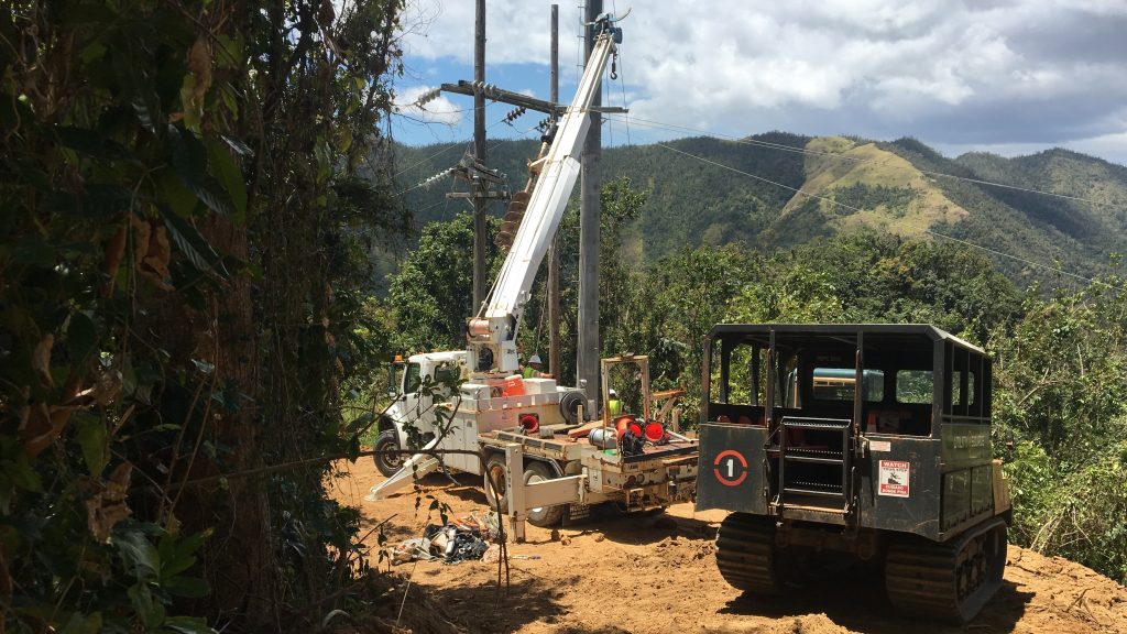 Contractors working to restore power in Cayey, Puerto Rico, last week, the same region where a falling tree interrupted a main transmission line Thursday, plunging 840,000 customers into darkness. Contractors working to restore power in Cayey, Puerto Rico, last week, the same region where a falling tree interrupted a main transmission line Thursday, plunging 840,000 customers into darkness. (Adrian Florido/NPR)