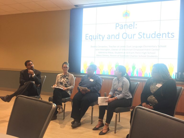 Former U.S. Education Secretary John B. King Jr. (left) holds a panel discussion about funding disparities in Delaware schools during a summit this week near Newark. (Cris Barrish/WHYY)
