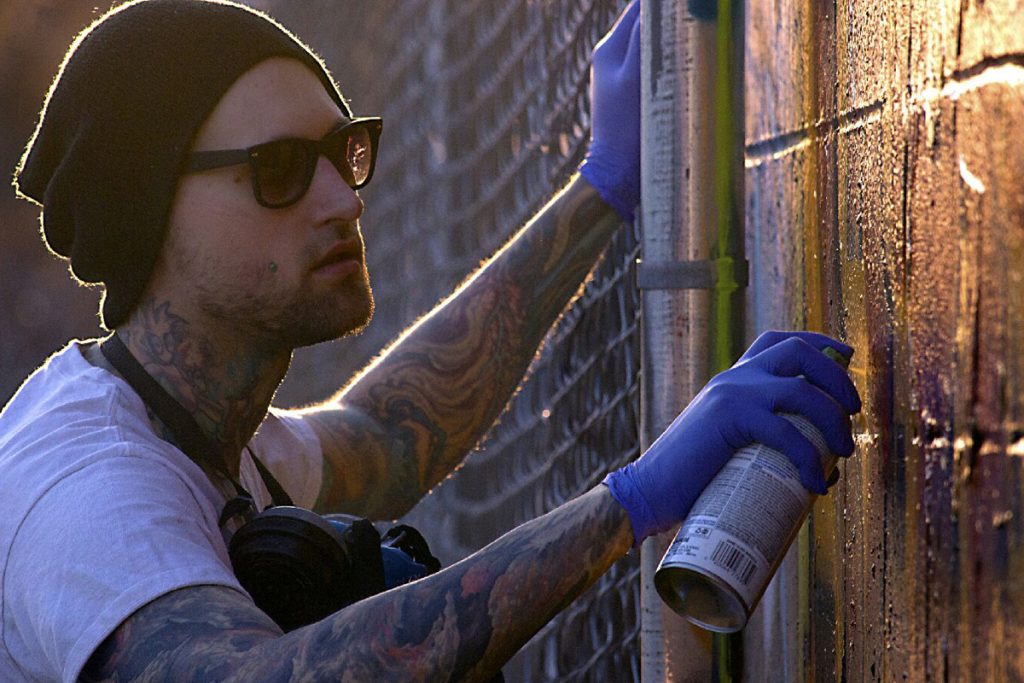 lovett_02 Evan Lovett said when he was injured in a fire it made him realize how important being able to draw and paint was to me. (Photo courtesy of Wes Genarie.)