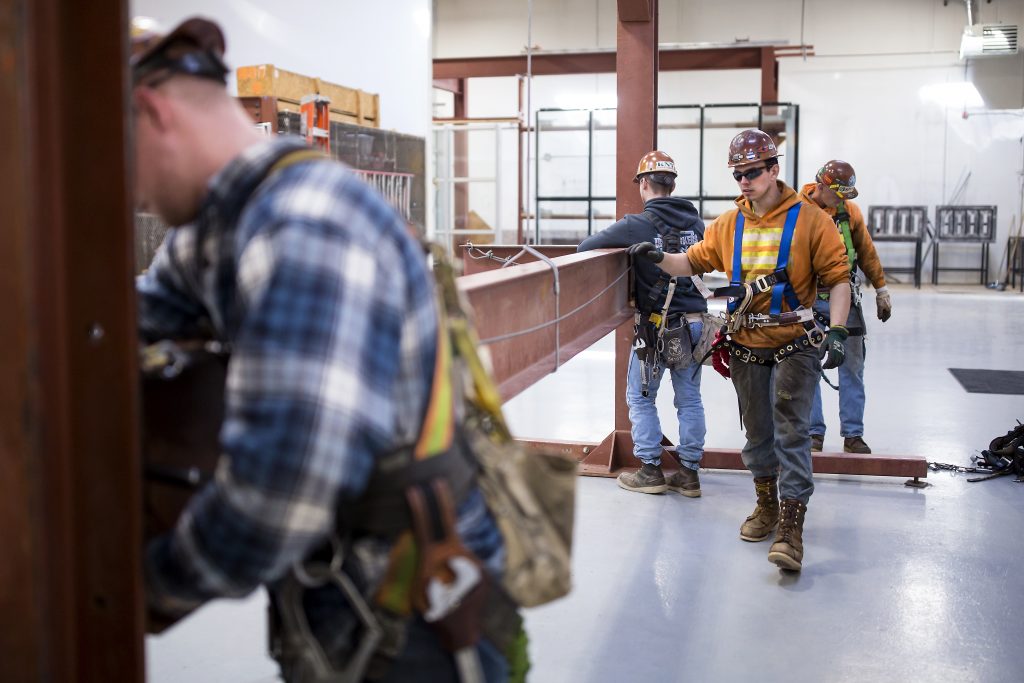Garret Morgan (center) is training as an ironworker near Seattle and already has a job that pays him $50,000 a year. Garret Morgan (center) is training as an ironworker near Seattle and already has a job that pays him $50,000 a year. (Sy Bean/The Hechinger Report)