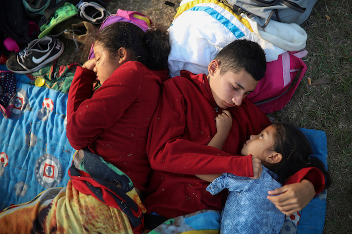 The Week That Was in Latin America Photo Gallery In this April 4, 2018 photo, the Zelaya siblings, from El Salvador, Nayeli, right, Anderson, center, and Daniela, huddle together on a soccer field, at the sports club where Central American migrants traveling with the annual