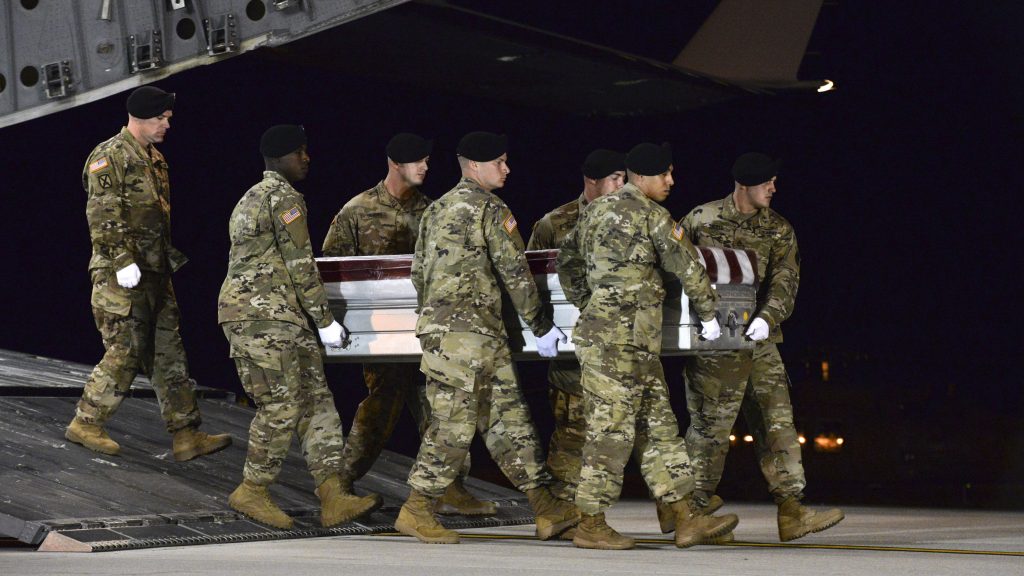 A U.S. Army team transfers the remains of Staff Sgt. Dustin Wright, 29, of Lyons, Ga., at Dover Air Force Base, Del., on Oct. 5. Wright was one of four U.S. troops killed in an ambush in Niger. A U.S. Army team transfers the remains of Staff Sgt. Dustin Wright, 29, of Lyons, Ga., at Dover Air Force Base, Del., on Oct. 5. Wright was one of four U.S. troops killed in an ambush in Niger.
Staff Sgt. Aaron J. Jenne/U.S. Air Force via AP