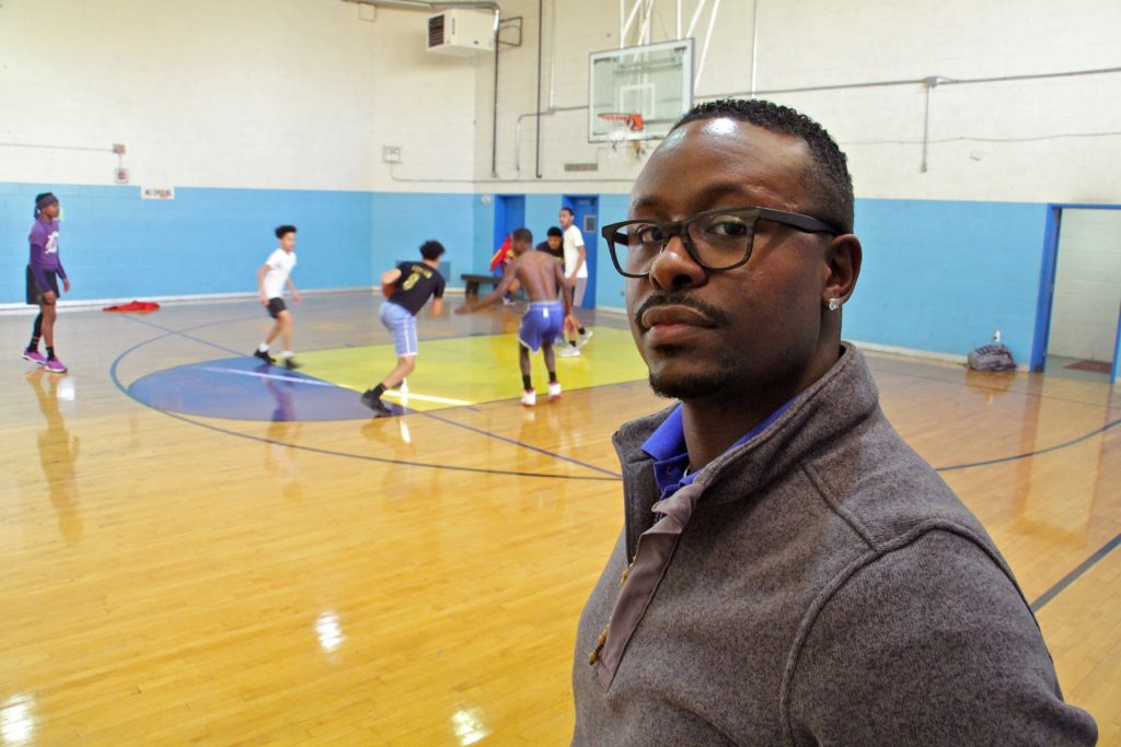 2018 03 09-e lee-quan king-philadelphia cobbs creek rec center-young trainee Trainee Quan King looks in on the open gym at Cobbs Creek Rec Center.