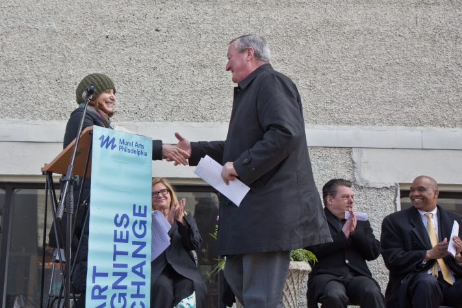 Philadelphia Mayor Jim Kenney (right) congratulates Mural Arts executive director Jane Golden. (Kimberly Paynter/WHYY)