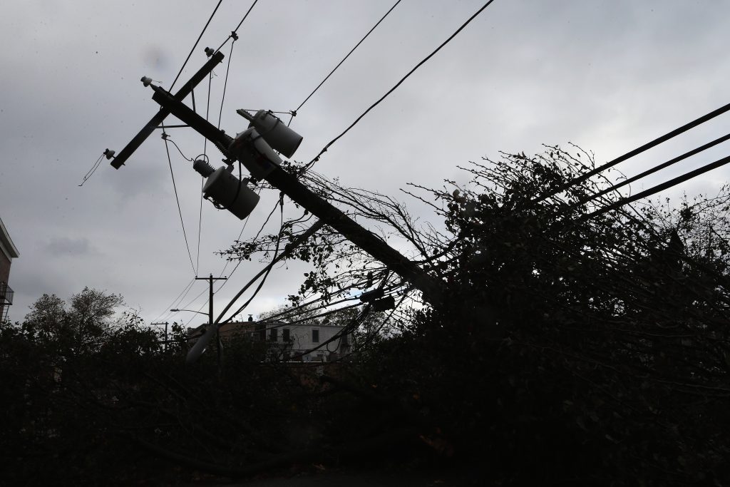 Scientists have been studying the link between climate change and extreme weather events such as Hurricane Sandy, which left more than 1.3 million Pennsylvanians in the dark in 2012. (Bruce Bennett/Getty Images)