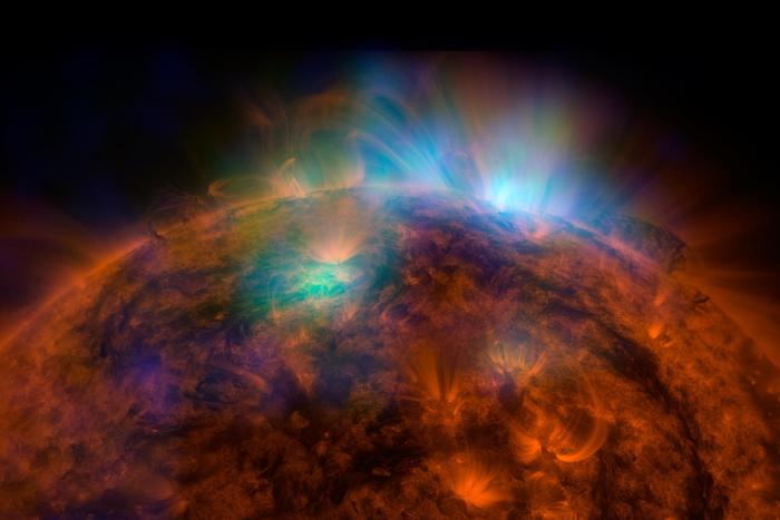 X-rays stream off the sun in this first picture of the sun, overlaid on a picture taken by NASA's Solar Dynamics Observatory (SDO), taken by NASA's NuSTAR. The field of view covers the west limb of the sun.
