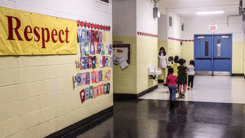 Students at Wister Elementary walk in single file to a class in October 2015. (Kimberly Paynter/WHYY)