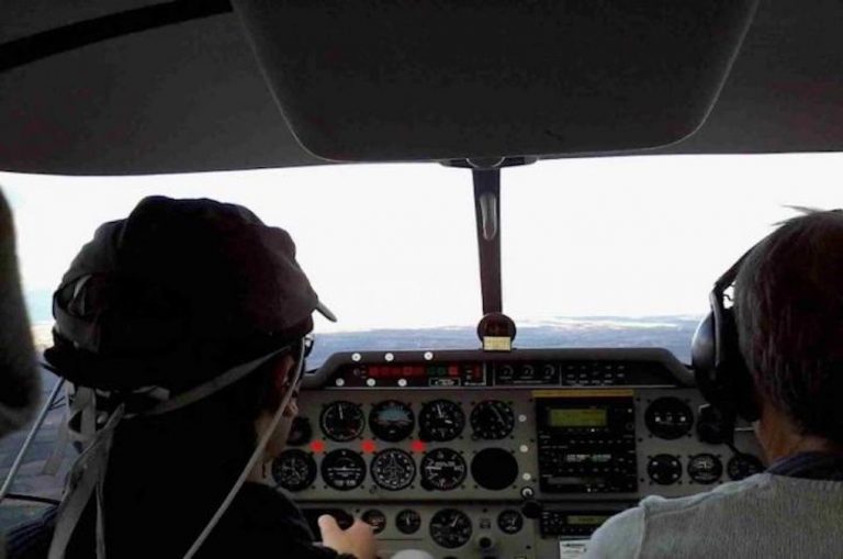 A pilot wears a wireless headband that tracks his brain activity, while flying a plane. Photo courtesy of ISAE-SUPAERO.