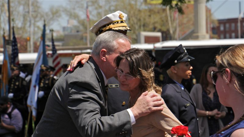 Philadelphia Mayor Jim Kenney greets a participant in the Living Flame Memorial Service. (Emma Lee/WHYY)