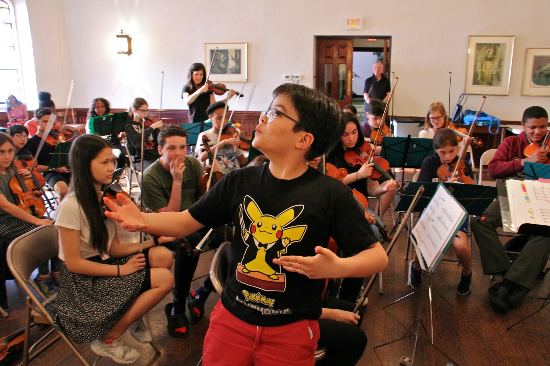 Cyrano Rosentrater, 10, whistles his part during a Musicopia rehearsal at the First Presbyterian Church in Philadelphia.