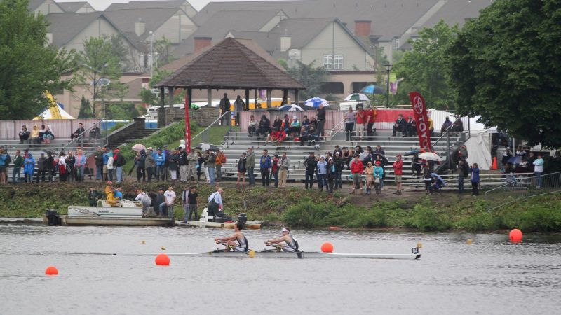 A two-man crew from the Episcopal School of Dallas, Texas, rows past the grandstand during the Stotesbury Cup time trials on the Cooper River. (Emma Lee/WHYY)