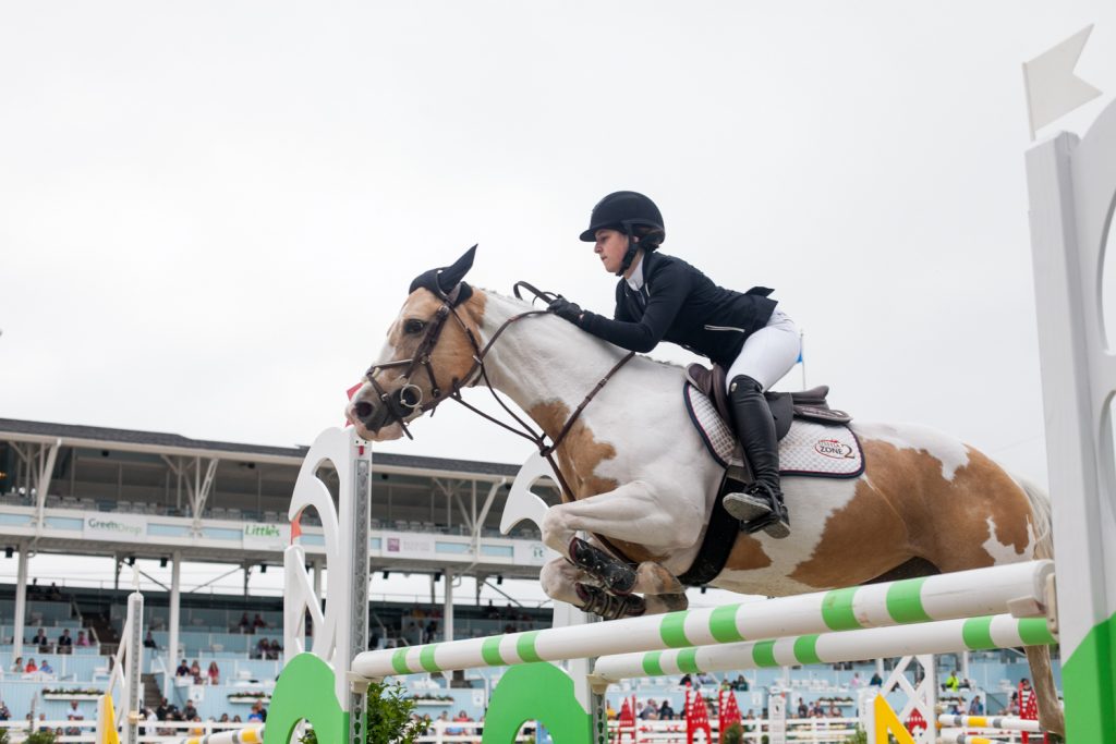 2018 05 20-b larrison Devon PA Horse Show-19 Holly Koczon jumps her horse Angel at the 122nd annual Devon Horse Show Sunday, May 27. (Brad Larrison for WHYY)