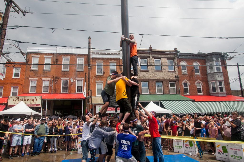 2018 05 20-b larrison south philadelphia- italian market festival grease pole climbing contest-14 After the weather cleared the South Philly team made another attempt to climb the grease pole. (Brad Larrison for WHYY)