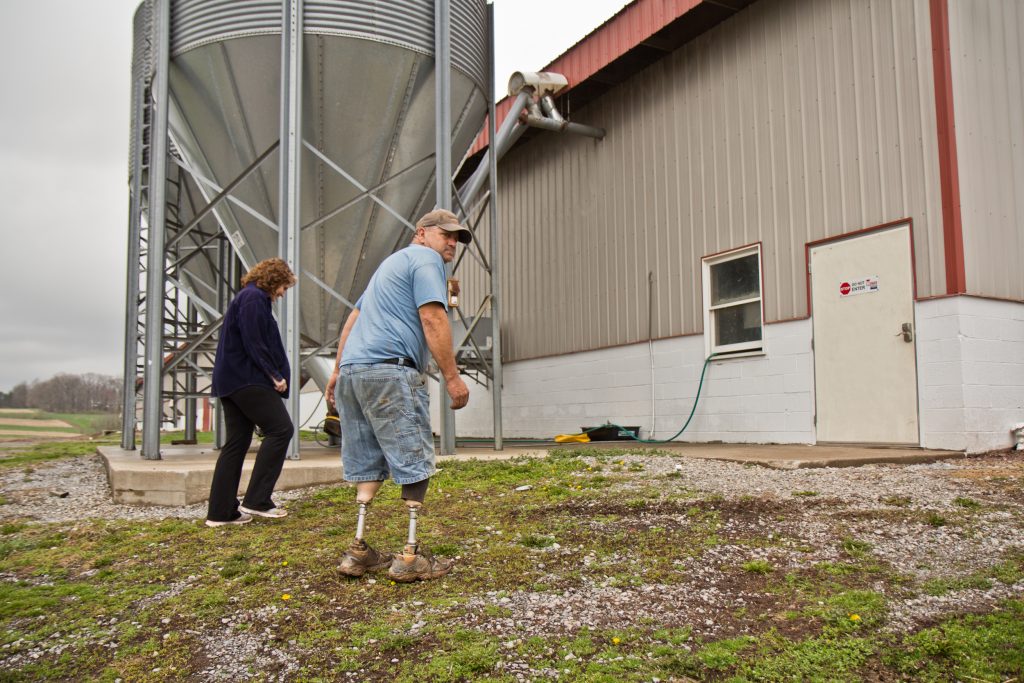 2018 4 27 k paynter dennis hunsberger chicken farm in middleburg pa-2 (2) Dennis Hunsberger and his wife Lori at the chicken house on his farm. (Kimberly Paynter/WHYY)