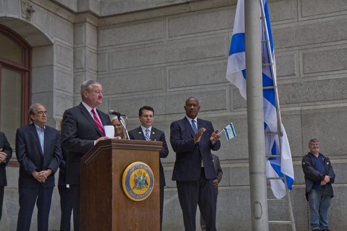 The flag of Israel is raised above City Hall in Philadelphia Monday. (Kimberly Paynter/WHYY)