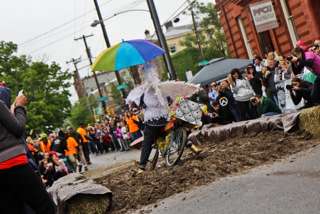 A participant barrels through the mud pit at the 2018 Kensington Kinetic Sculpture Derby. (Kimberly Paynter/WHYY)