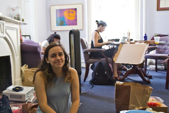 Swarthmore student Morgin Goldberg sits in the office of Liz Braun, dean of students, to protest the school's handling of sexual assault allegations. (Kimberly Paynter/WHYY)