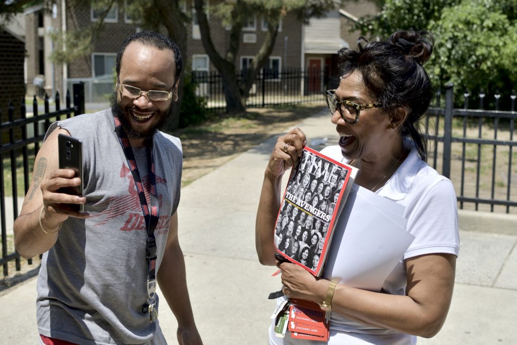 20180526_Youngblood_Profile_BS1441 Congressional candidate Tanzie Youngblood holds up a Time magazine with her photo on the cover as Will Brant uses his phone to record a Snapchat story. Youngblood was campaigning at a low-income housing project in Bridgeton, New Jersey, on May 26, 2018.