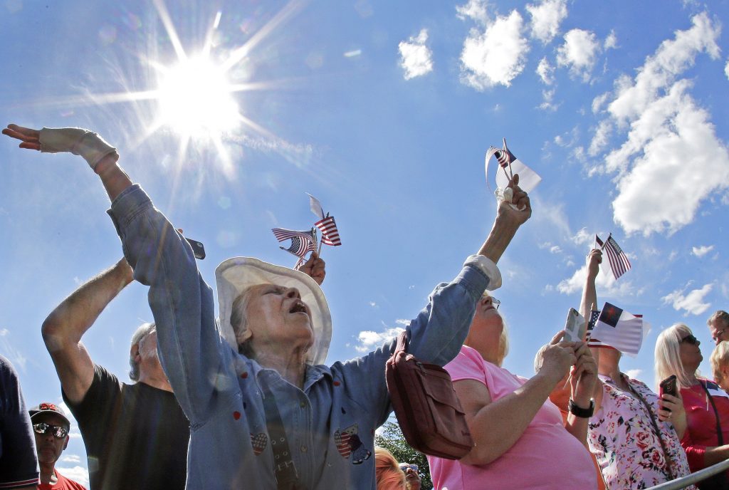 Boston Common Evangelicals Ernestine Cuellar raises her hands in prayer during a rally on Boston Common in 2016. (Elise Amendola/AP Photo)
