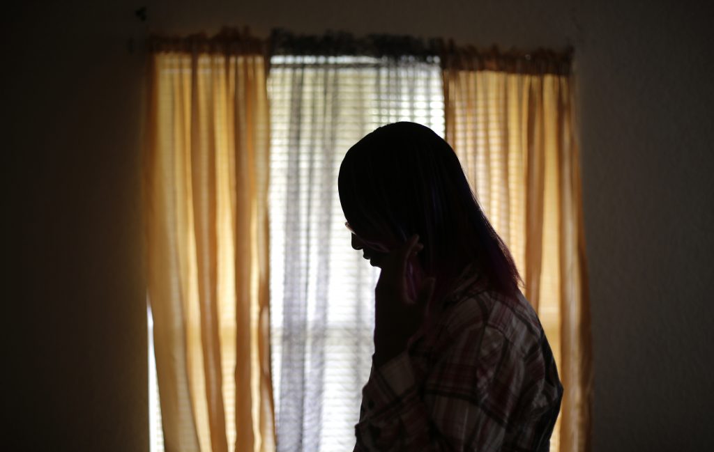 In this Monday, Dec. 5, 2016 photo, a 19-year-old transgender teen, who declined to be identified because she feared for her life after receiving death threats this summer at a halfway house, poses for a photo. (Eric Gay/AP Photo)