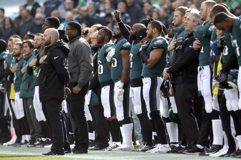 Philadelphia Eagles' Malcolm Jenkins, (center), gestures during the national anthem before an NFL football game against the Chicago Bears, Sunday, Nov. 26, 2017, in Philadelphia.