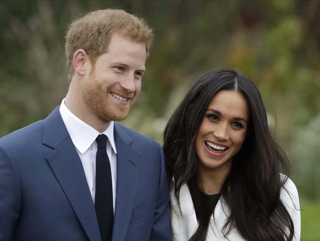 Britain Royal Engagement Britain's Prince Harry and his fiancee Meghan Markle pose for photographers during a photocall in the grounds of Kensington Palace in London, Monday Nov. 27, 2017.
