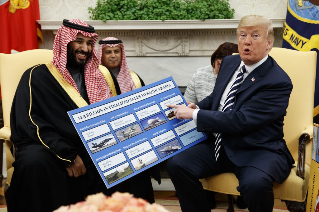 Donald Trump, Mohammed bin Salman President Donald Trump shows a chart highlighting arms sales to Saudi Arabia during a meeting with Saudi Crown Prince Mohammed bin Salman in the Oval Office of the White House, Tuesday, March 20, 2018, in Washington.