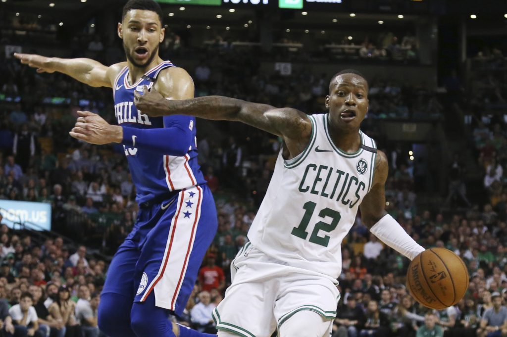 Terry Rozier, Ben Simmons Boston Celtics guard Terry Rozier (12) dribbles by Philadelphia 76ers guard Ben Simmons in the second half of Game 2 of an NBA basketball second-round playoff series, Thursday, May 3, 2018, in Boston. The Celtics won 108-103. (AP Photo/Elise Amendola)