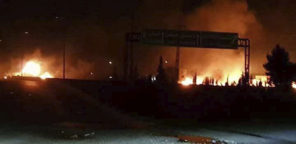 Syria This photo released on Wednesday, May 9, 2018, by the Syrian official news agency SANA, shows flames rising after an attack in an area known to have numerous Syrian army military bases, in Kisweh, south of Damascus, Syria. Syrian state-run media said Israel struck a military outpost near the capital Damascus on Tuesday, saying its air defenses intercepted and destroyed two of the incoming missiles. The reported attack came shortly after U.S. President Donald Trump announced he was withdrawing from the Iran nuclear deal, calling Tehran a main exporter of terrorism in the region. (SANA via AP)