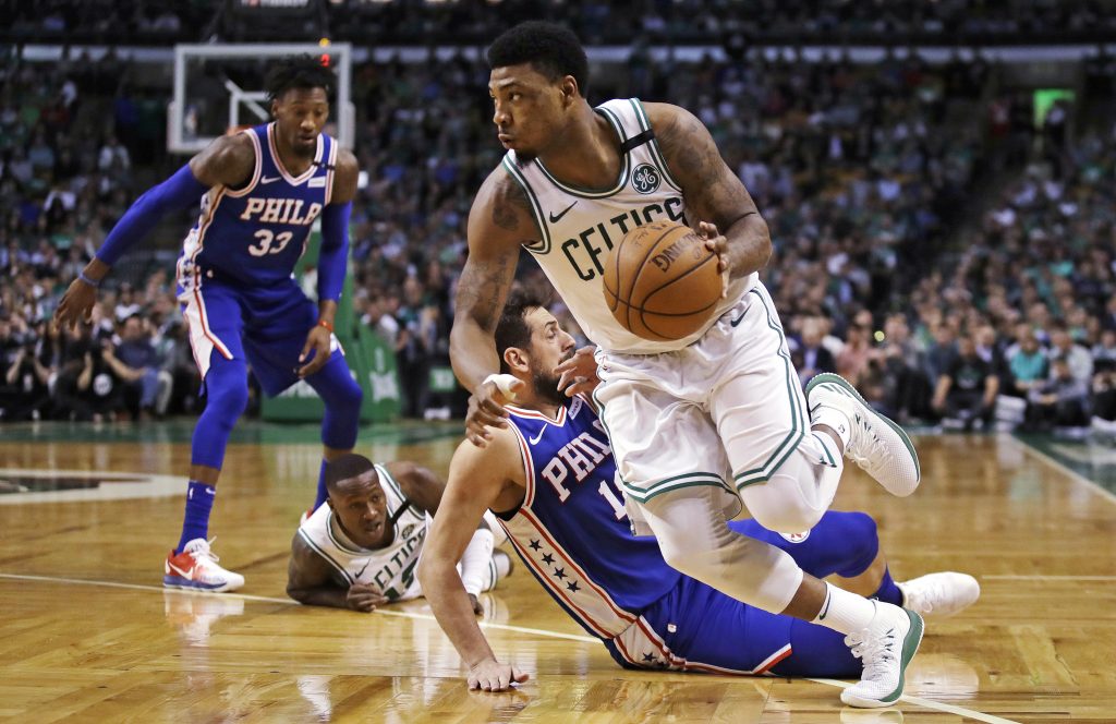 Marcus Smart, Marco Belinelli Boston Celtics guard Marcus Smart, right, drives past Philadelphia 76ers guard Marco Belinelli during the first quarter of Game 5 of an NBA basketball playoff series in Boston, Wednesday, May 9, 2018. (AP Photo/Charles Krupa)