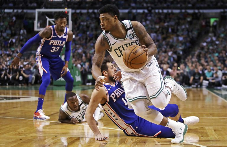 Boston Celtics guard Marcus Smart, right, drives past Philadelphia 76ers guard Marco Belinelli during the first quarter of Game 5 of an NBA basketball playoff series in Boston, Wednesday, May 9, 2018. (AP Photo/Charles Krupa)