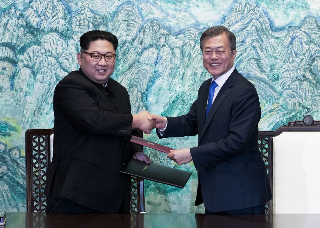 In this April 27, 2018 file photo, North Korean leader Kim Jong Un, (left), and South Korean President Moon Jae-in shake hands after signing on a joint statement at the border village of Panmunjom in the Demilitarized Zone, South Korea. The two Koreas will hold a high-level meeting on Wednesday, May 16, 2018, to discuss setting up military and Red Cross talks aimed at reducing border tension and restarting reunions between families separated by the Korean War. (Korea Summit Press Pool via AP, File)