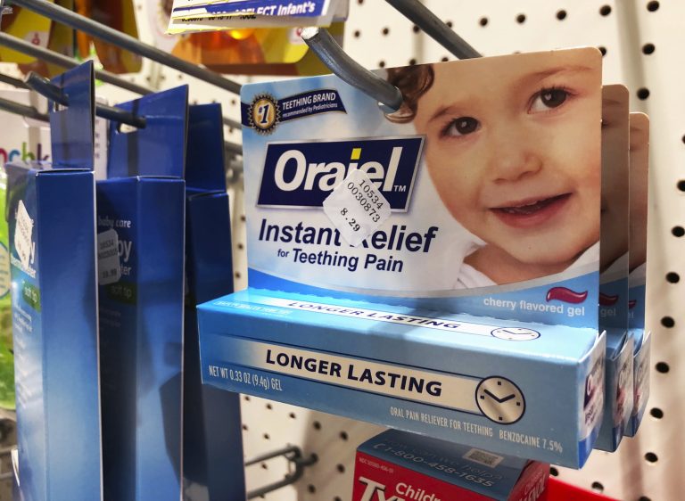 Orajel is displayed for sale in a pharmacy in New York Wednesday, May 23, 2018. The US Food and Drug Administration is warning parents about potentially deadly risks of teething remedies that contain a numbing ingredient used in popular brands like Orajel. The agency on Wednesday said it wants manufacturers to stop selling products intended for babies and toddlers because the products contain a drug ingredient that can cause a rare but dangerous blood condition that interferes with normal breathing. (Stephanie Nano/AP Photo)