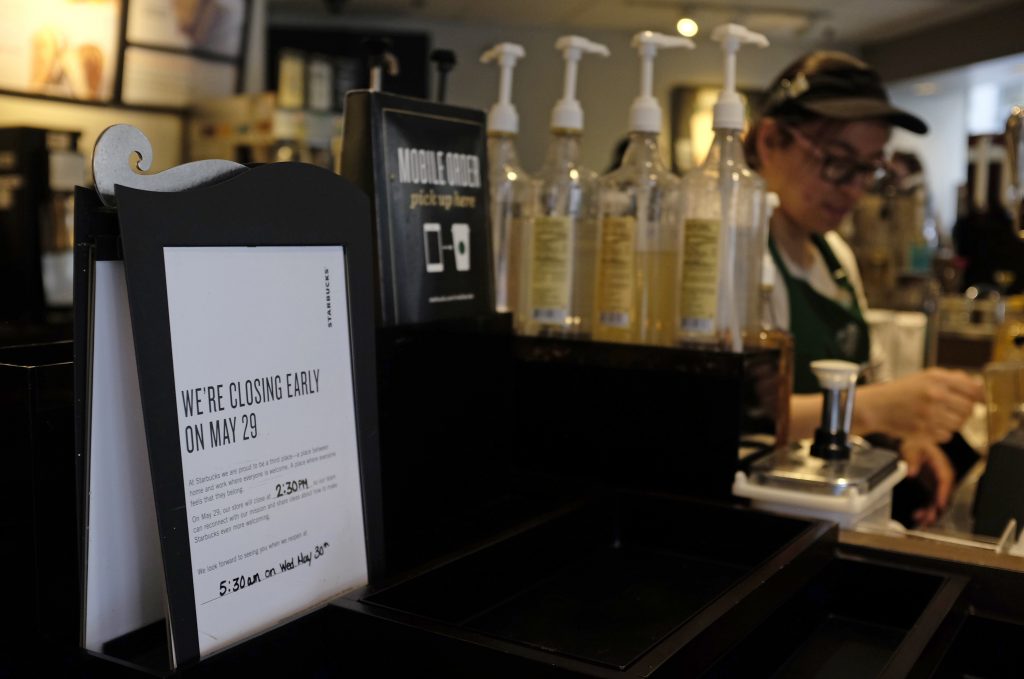 Starbucks Training A store closing sign for May 29 is posted at a pickup counter at a Starbucks store, Friday, May 25, 2018, in Chicago. Starbucks will close more than 8,000 stores nationwide on Tuesday to conduct anti-bias training, the next of many steps the company is taking to try to restore its tarnished diversity-friendly image.