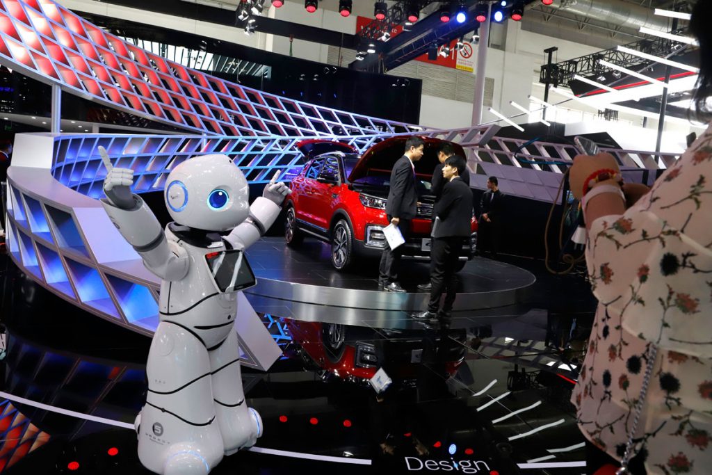 APuschinatechtradex1200 In this April 26, 2018, photo, a robot entertains visitors at the booth of a Chinese automaker during the China Auto 2018 show in Beijing, China. Under President Xi Jinping, a program known as